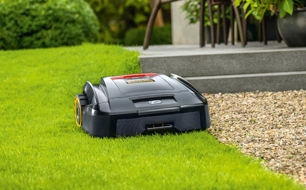 Autonomous mower cutting grass in a flat yard