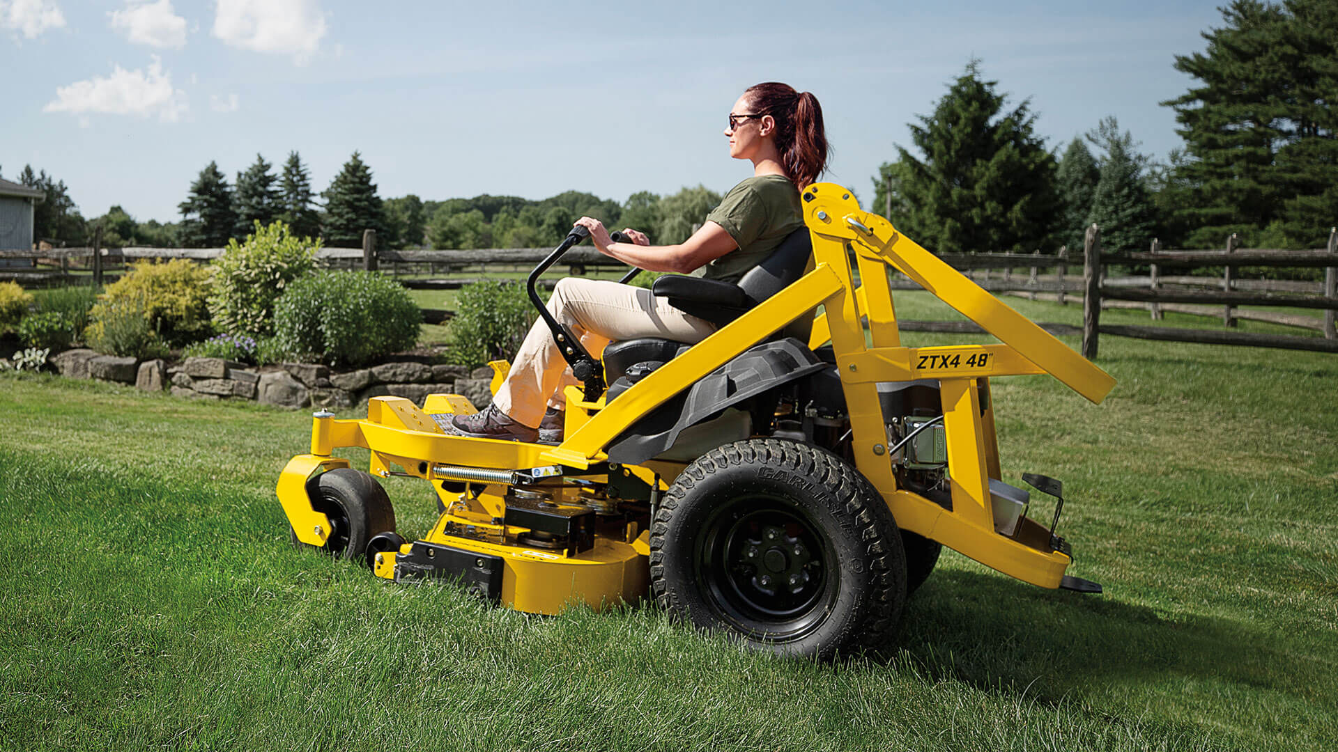 woman-riding-ztxs4-zero-turn