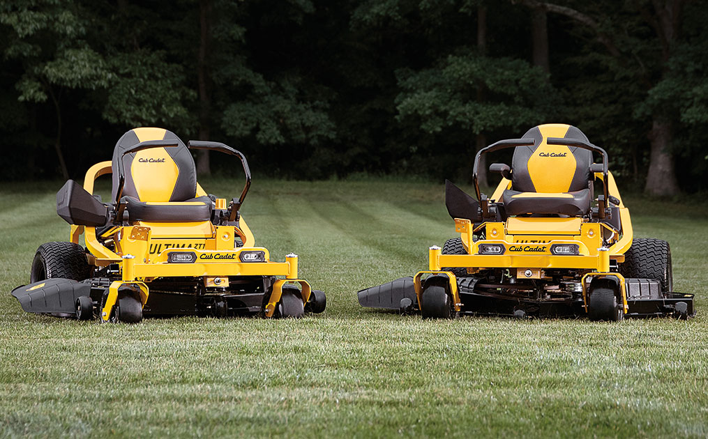 woman riding zero turn mower