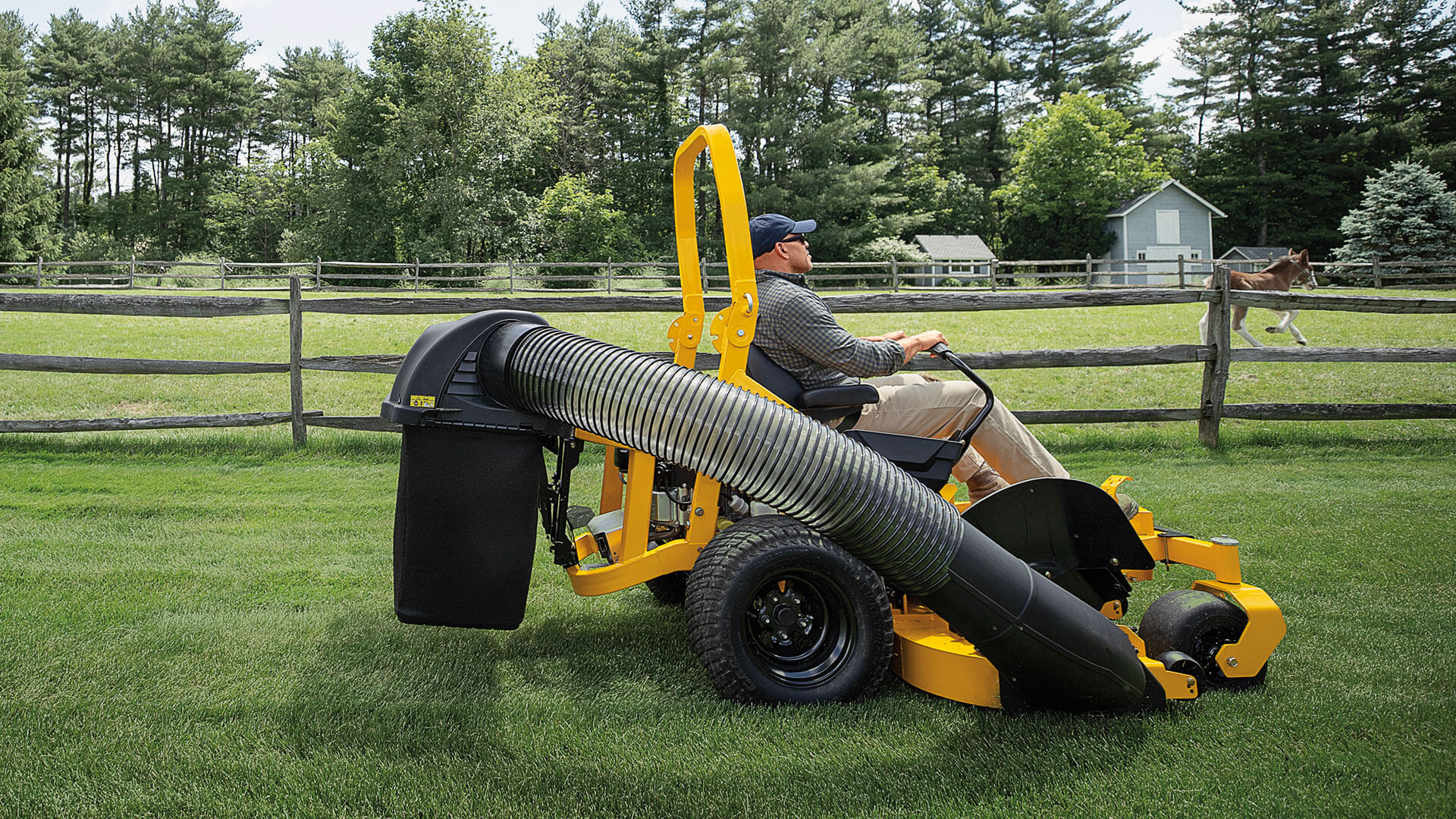 man-riding-ztx4-60-with-bagger-attachment