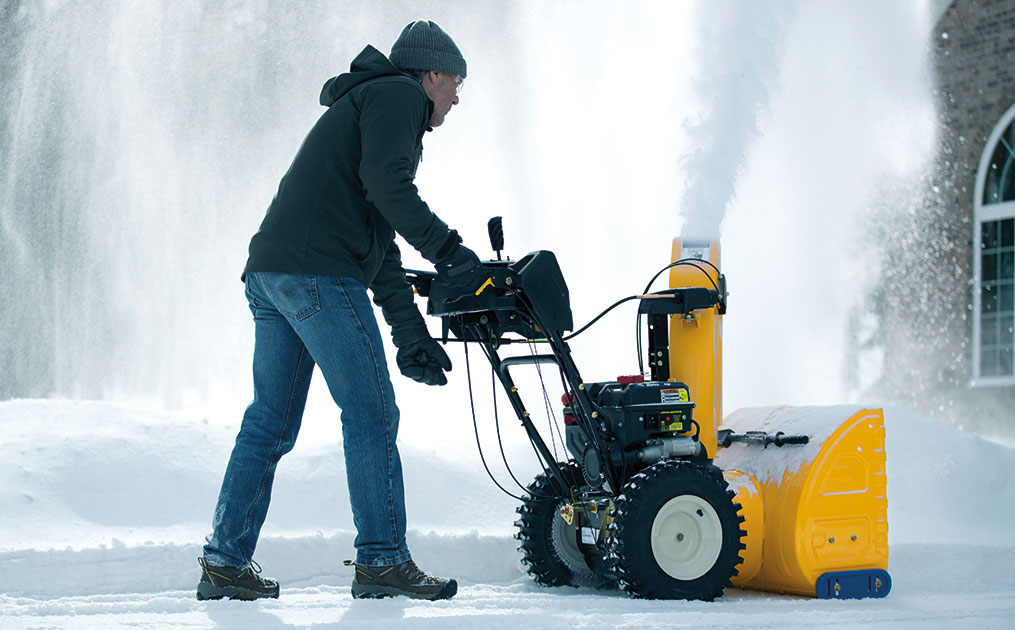 man-blowing-snow