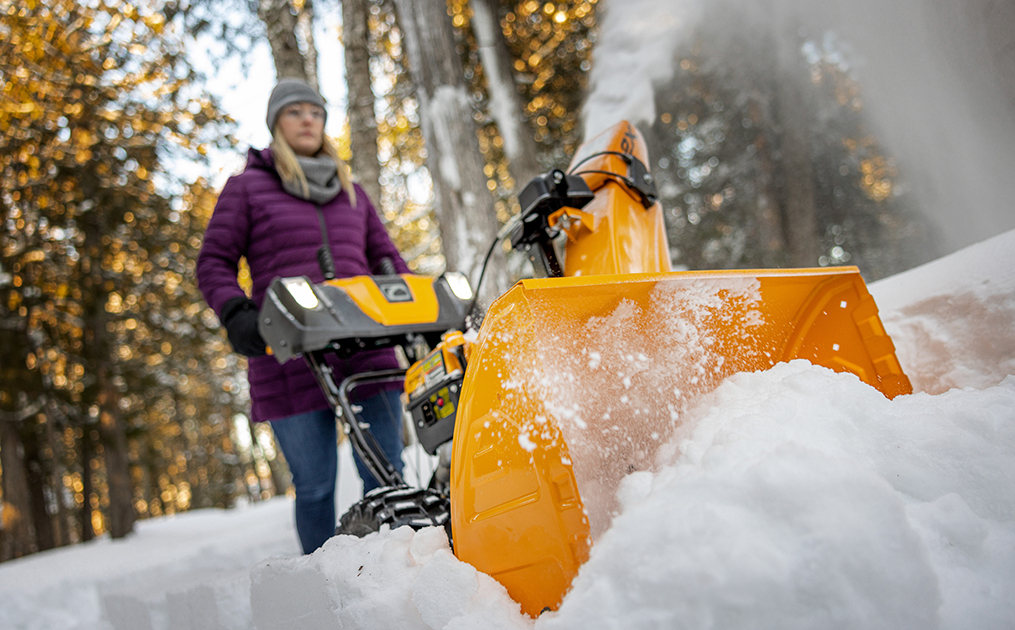 Up close shot of 2x 28 inch snow blower blowing through heavy snow