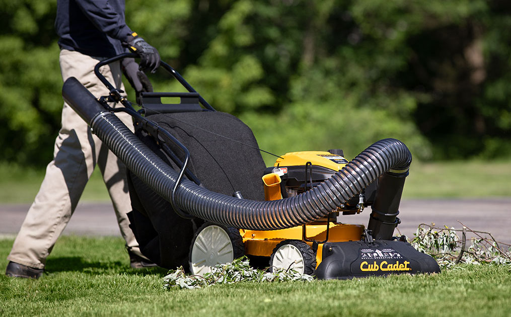 Man pushing shredder vacuum