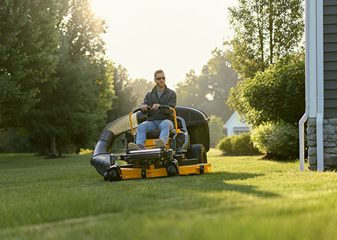 man on zero turn lawn mower