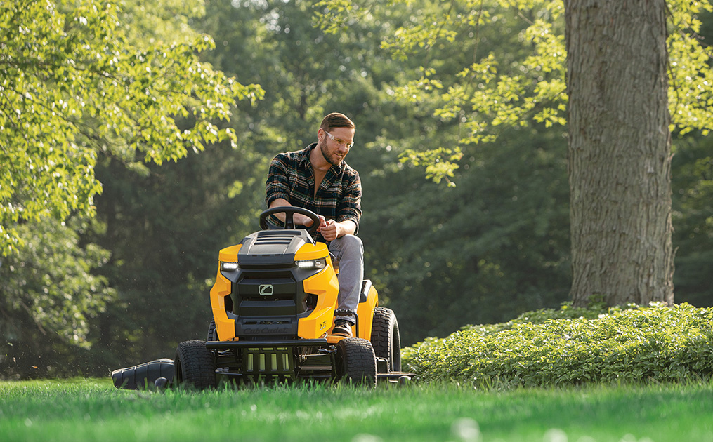 man cutting lawn with new xt2 riding mower